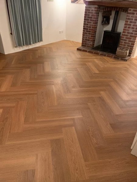 Parquet Flooring in a lounge with fireplace