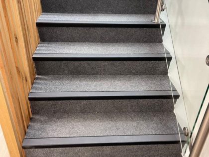 Simple carpet going up stairs - crown carpets
