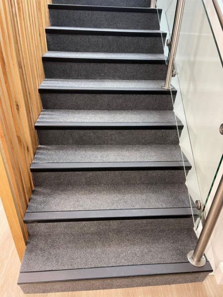 Simple carpet going up stairs - crown carpets