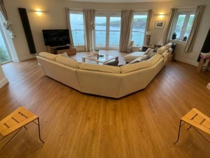 Full view of the wood flooring in the lounge - Crown Carpets
