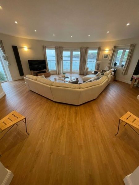 Full view of the wood flooring in the lounge - Crown Carpets